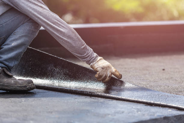 Professional Emergency Waterproofing technician working in East Lansing, MI